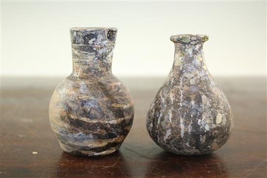 Two Syrian glass gourd flasks, c.6th century A.D., 8.5cm